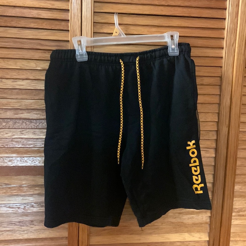 Black and orange Reebok shorts (Size M)